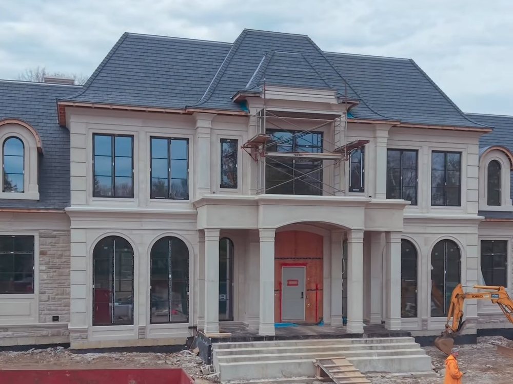 The French Manor on Doulton with a mixed natural stone façade and precast details