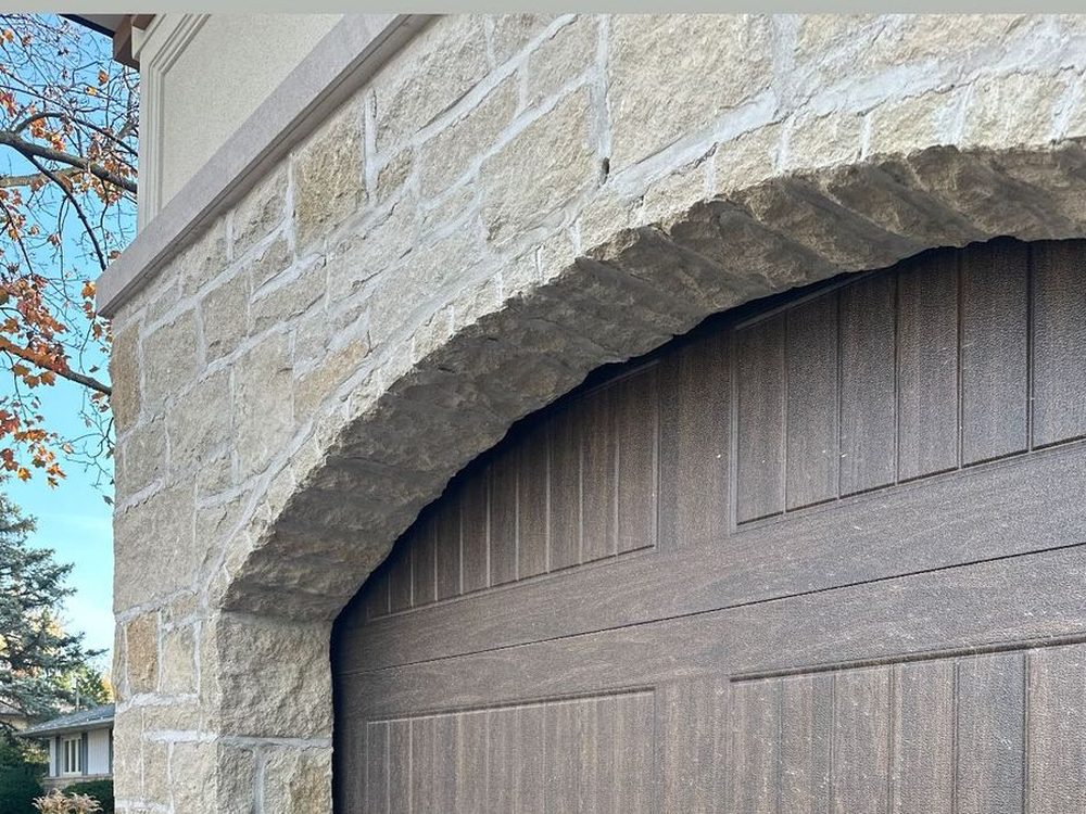 Old European style manor with a structural stone arch return